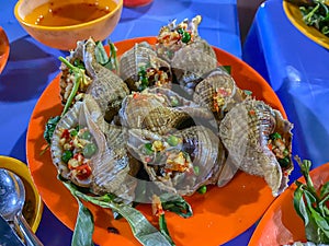 Delicious Vietnamese snails dish cooked with chili and peppercorn
