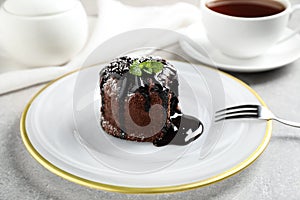 Delicious warm chocolate lava cake on table