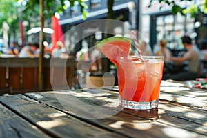 Delicious watermelon cocktail in glass at charming street cafe, perfect summer refreshment