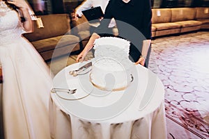 Delicious wedding cake at wedding reception in restaurant. waite