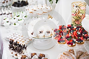 Delicious wedding reception candy bar dessert table