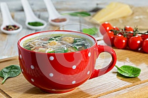 Delicious wedding soup with meatball, carrots and spinach