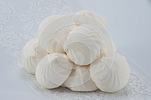 Delicious white marshmallows on a white background