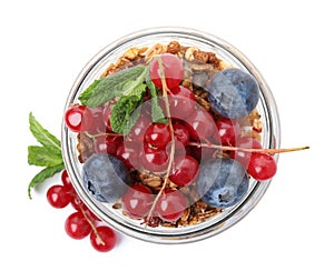 Delicious yogurt parfait with fresh berries and mint on white background, top view