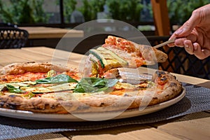 Delicious zucchini flower pizza, Italian Food on the terrace closeup photo