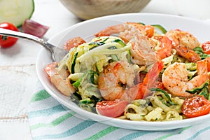 Delicious zucchini noodles with cherry tomato and prawns