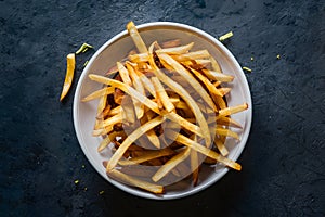 Deliciously cooked crispy french fries, an indulgent fast food treat