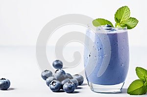 Deliciously Fresh: Homemade Blueberry and Mint Smoothie on a Crisp White Background.