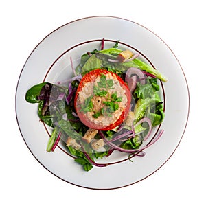 Deliciously tomato stuffed with tuna on a pillow of salad