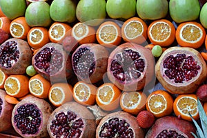 Delicous assorted fruits, green apples, orange and pomegranates