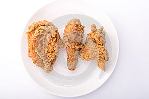 Delicous hot and crispy fried chicken isolated on a white background photo