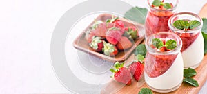Delicous and nutritious double color colour strawberry desserts with mint and diced sarcocarp topping  with airy blue