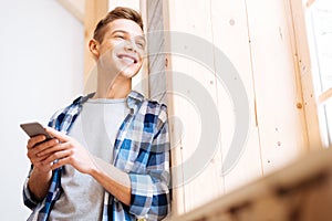 Delighted adolescent looking out the window