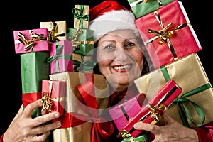 Delighted Aged Woman Embosoming Wrapped Presents