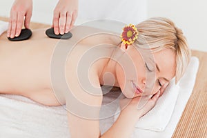 Delighted blonde woman receiving a massage