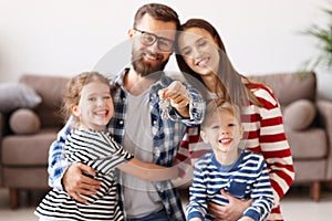 Delighted family with keys of new apartment