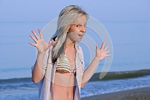 Delighted girl on beach.