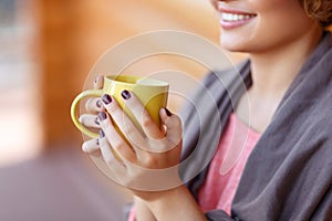 Delighted girl drinking tea