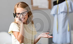 Delighted girl talking on the phone