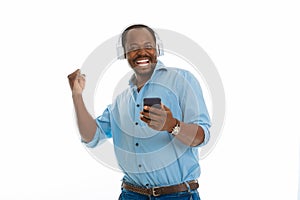 Delighted happy man holding his modern smartphone