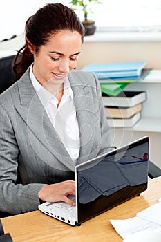 Delighted hispanic businesswoman working