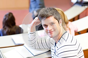 Delighted male student smiling during a lesson