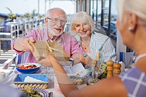 Delighted nice aged people having a celebration