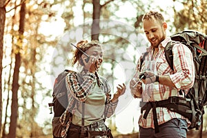 Delighted nice couple using their portable radio