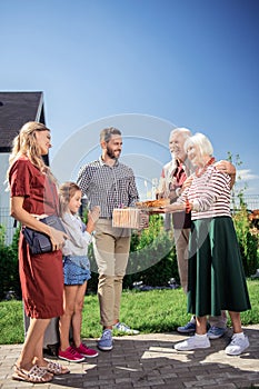 Delighted people going to celebrate Thanksgiving day