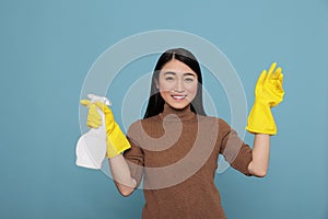 Delighted smiling and optimistic asian houseworker at work