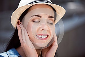 Delighted woman listening to music