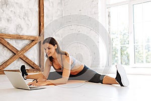 Delighted woman using laptop for training