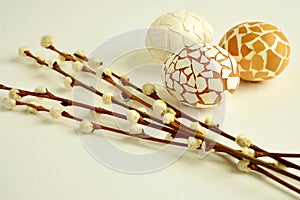 Delightful Easter decoration with mosaic eggs and willow twigs on white background