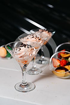 Swirled Peach Mousse with Chocolate Sprinkles in Martini Glasses