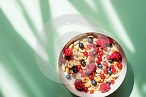 Deliscious healthy breakfast with flakes and fruits isolated on green background.muesli with yogurt .wholegrain muesli breakfast,