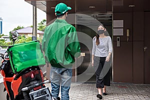 deliver pizza to office woman in face mask