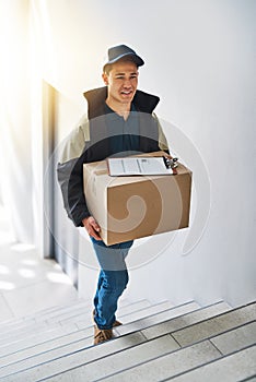 Deliveries done without any hassles. a courier making a delivery in an office. photo