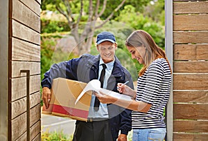 Delivering each package with a smile. Shot of a male courier delivering a package to a woman at her home.