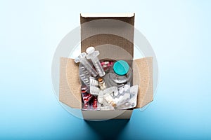 Delivery box filled with medicines and drugs.