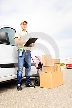 Delivery Boy Standing Next To His Van