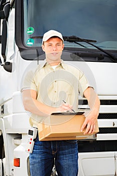 Delivery Boy Standing Next To His Van