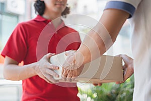 Delivery business service concept. Delivery Man sending packages to customer in front of house door