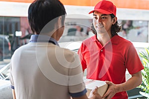 Delivery business service concept. Delivery Man sending packages to customer in front of house door