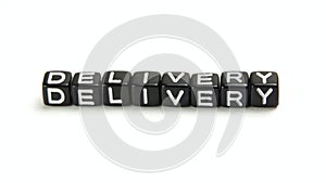 Delivery - Business Vocabulary Word on Black Dice isolated on white background