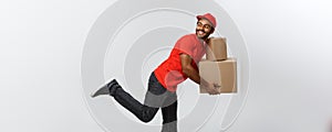 Delivery Concept - Handsome African American delivery man rush running for delivering a package for customer. 