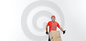 Delivery Concept - Portrait of Handsome African American delivery man or courier pushing hand truck with stack of boxes