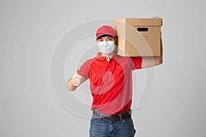 Delivery Concept - Set of Portrait of Asian delivery man with face mask in red cloth holding a box package