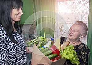 Delivery food during virus outbreak, coronavirus panic and pandemics. Stay safe at Home. Social worker helps retirees in the