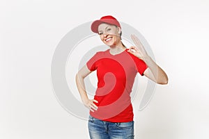Delivery friendly woman in red uniform isolated on white background. Professional caucasian female in cap, t-shirt