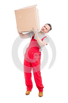 Delivery guy carrying big cardboard box like moving